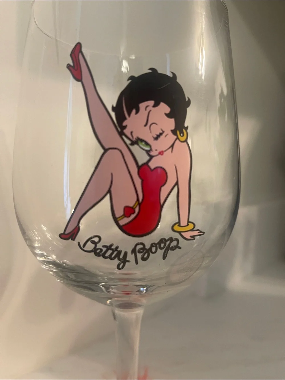 Betty Boop Clear Wine Glass with Red Artwork and Red Feather Base